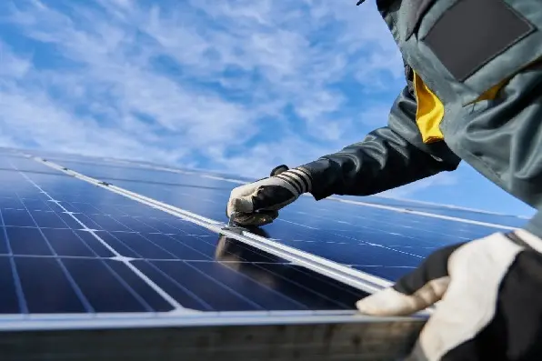 Technician working on a solar panel
